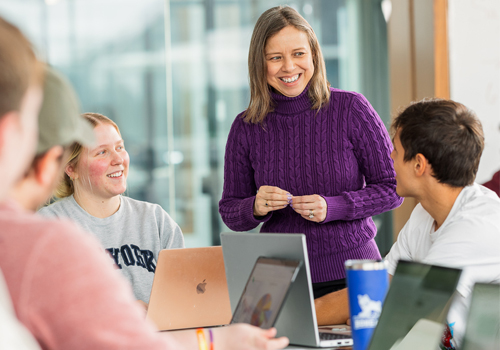 Instructor listening to students