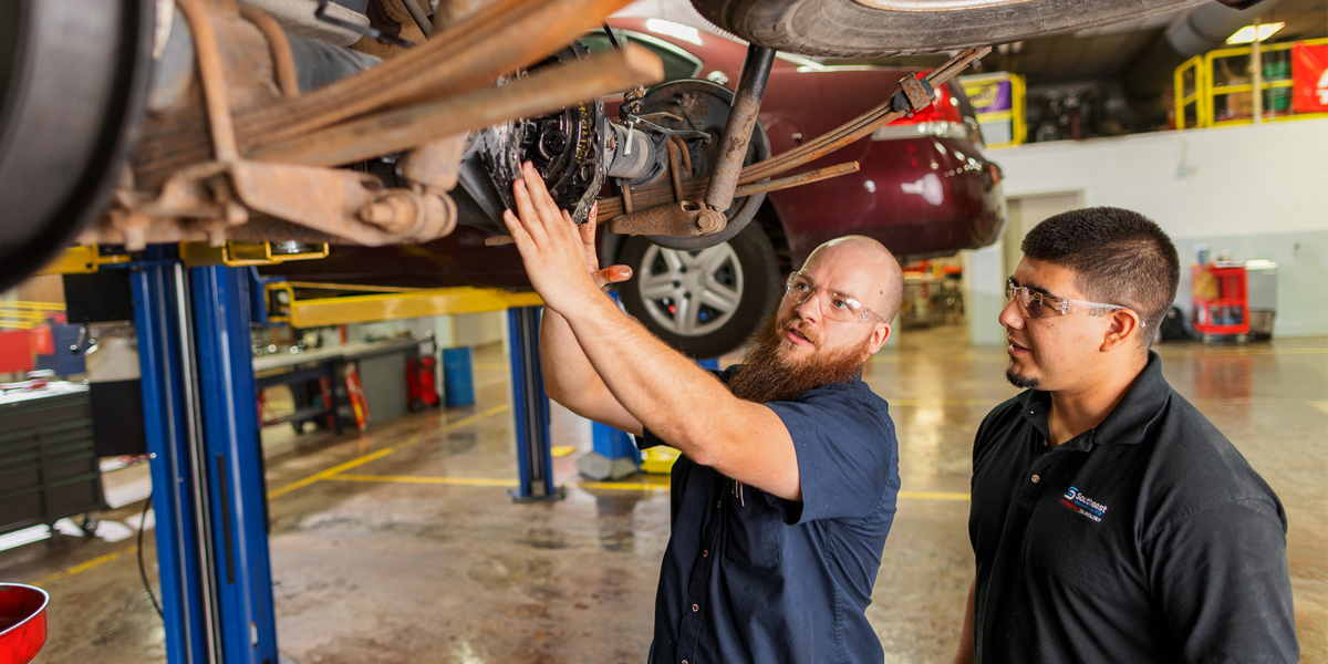 Student and instructor in automotive technology